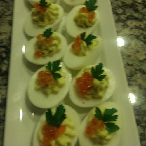 Fancy deviled eggs with salmon caviar, (a private 