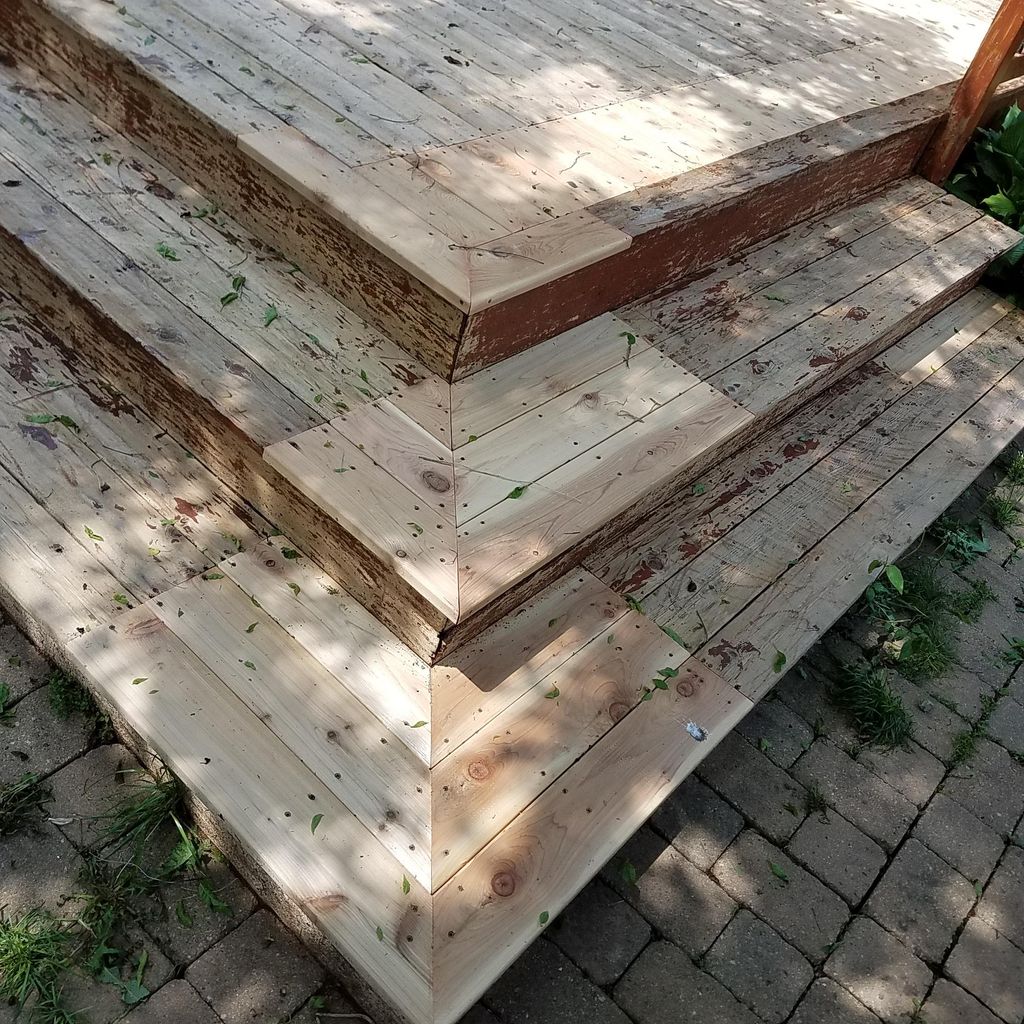 This deck was power washed, repaired, and coated t