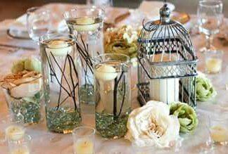 Beautiful bird cages, crystal vases with candles a