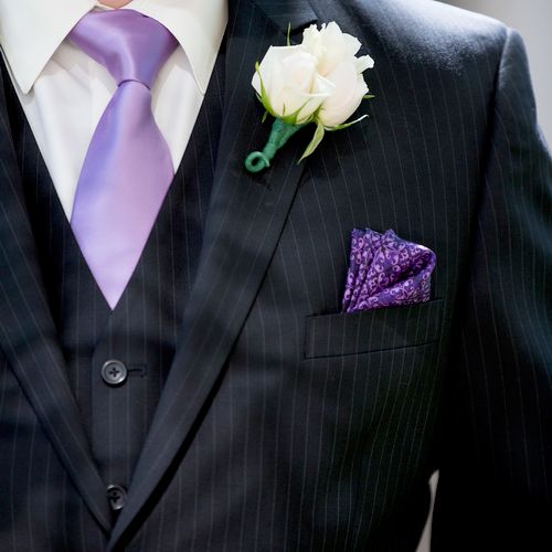Groom boutonniere in white roses