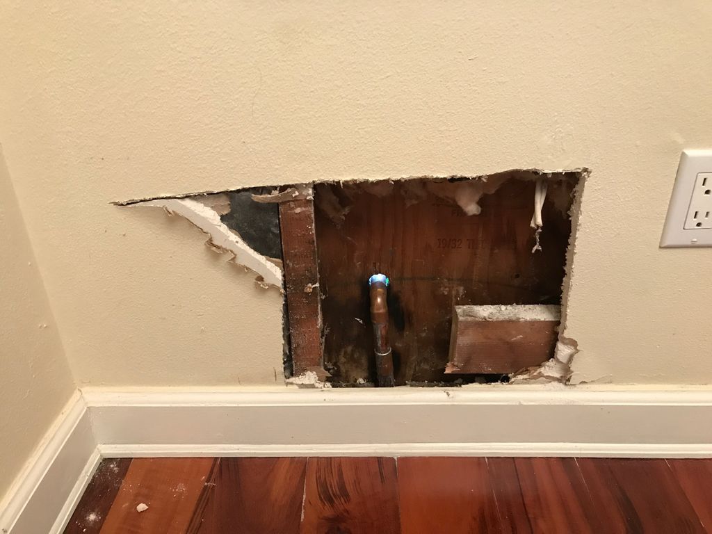 BEFORE: Water leak from spigot on opposite side. T