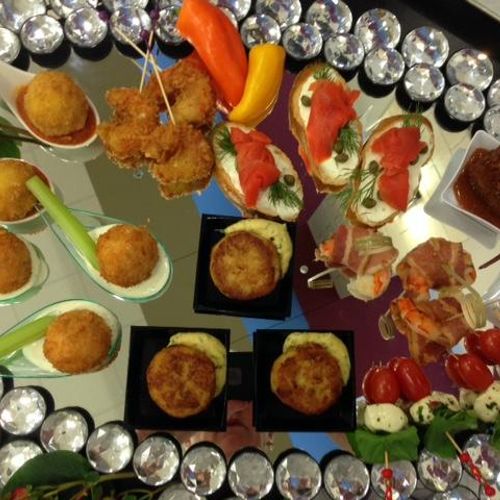 Assorted hot hors d' oeuvres, cooked on site