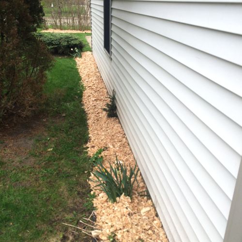 Bark chip installation on a residential property.