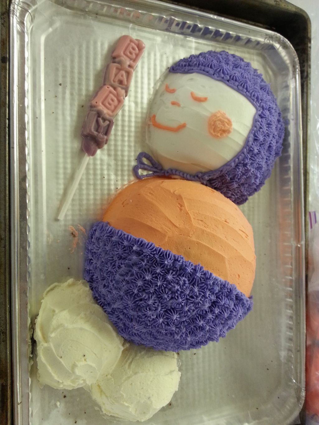 Baby shower cake and molded candy.