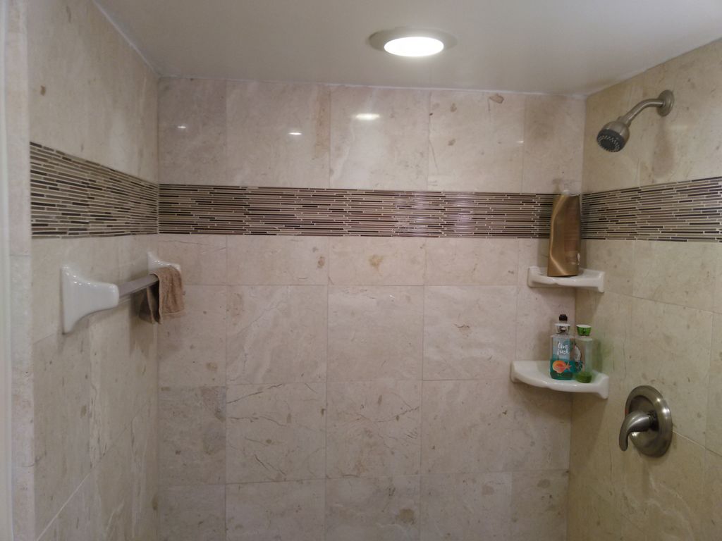 Shower Enclosure re-tiled with glass insert