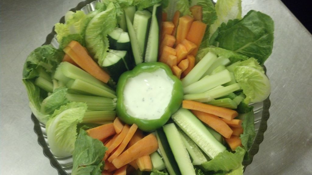 Vegetable tray garnished with romaine.