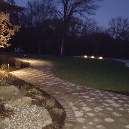 paver walkway with landscape lighting