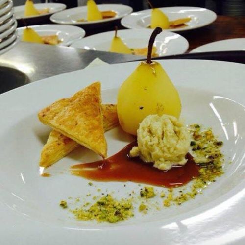 Riesling poached pear with whiskey caramel, pistac