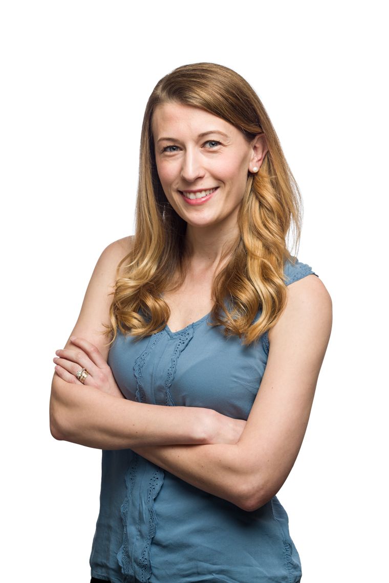 Waist-up headshot on a pure white background