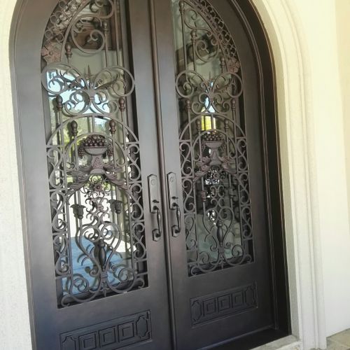 Repaired and painted custom steel entrance doors