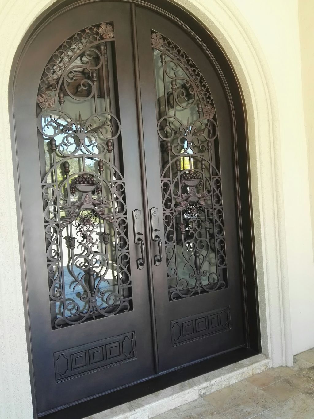 Repaired and painted custom steel entrance doors