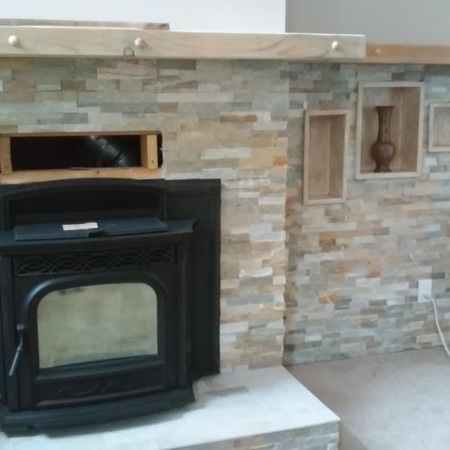 Tile and pellet stove installation in progress.