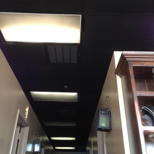 Customer wanted the white drop ceiling painted bla