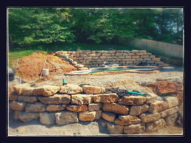 Boulder retaining walls for pool
