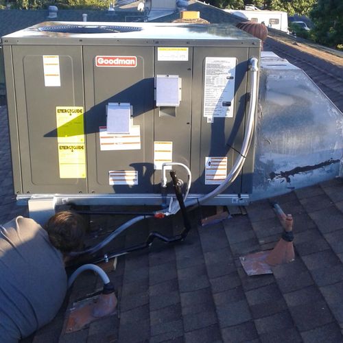 3 ton package unit installation on top of a home.