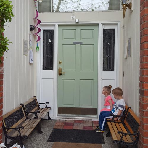 Front door with teeny benches.Here we learn to be 