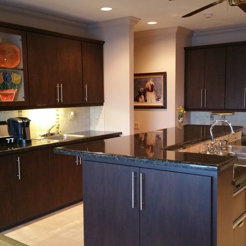 AFTER REMODELING Counter tops are black granite.  
