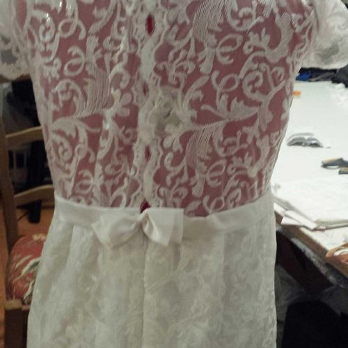 The back which features handmade lace.