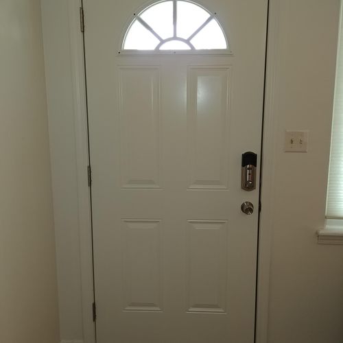 New metal entry door with electronic lock.
