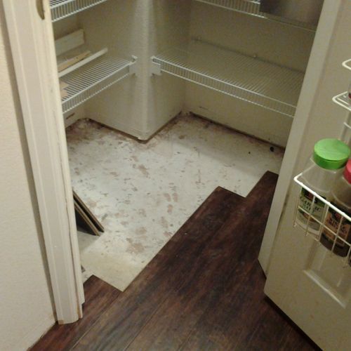 The laminate floor was installed into the pantry. 