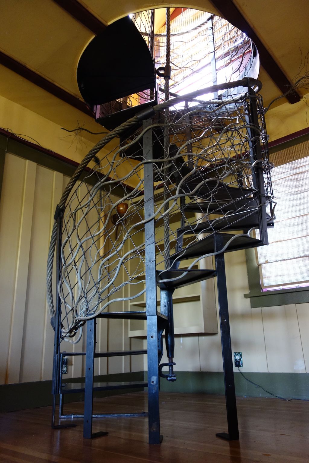Blackened steel Spiral staircase and wire rope han