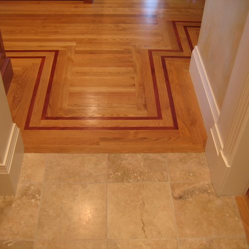 Seamless wood floor to travertine