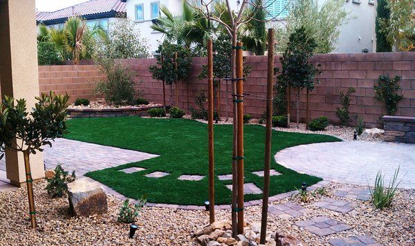 Artificial grass back yard landscape design