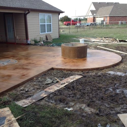 Concrete Patio install with fire pit, and stained 