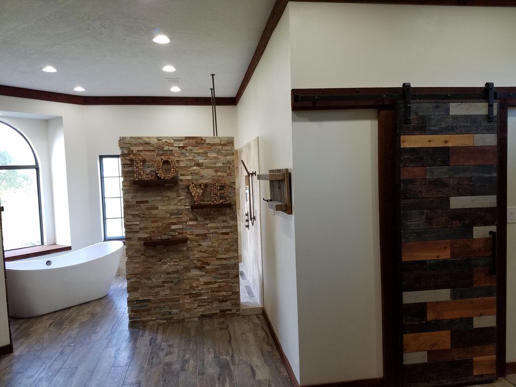 Custom designed bathrooms with soaking tub, walk i