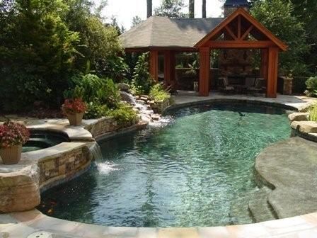 Pool spa with open pavilion and fireplace