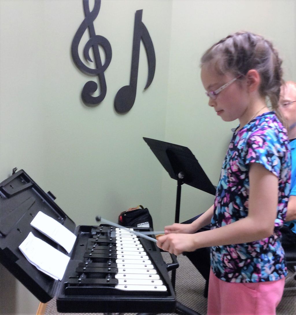 Sienna playing her xylophone