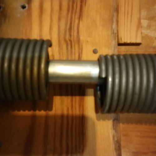 This Is a Broken Torsion Spring . We Have All The 