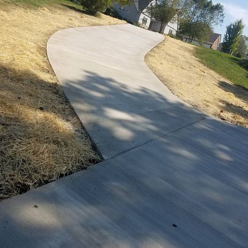 New construction. Long driveway and sidewalk syste