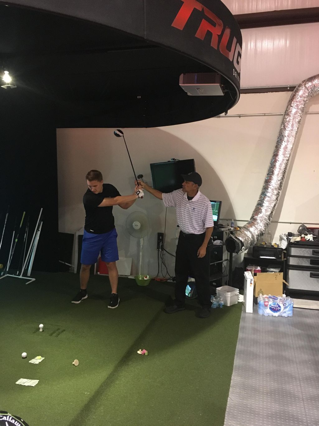 Working on a golf swing at a private studio.