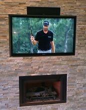 Mounted customers TV above fireplace with their ce