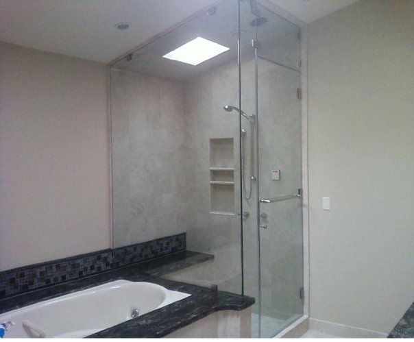 Heavy glass custom steam shower lots of out condit
