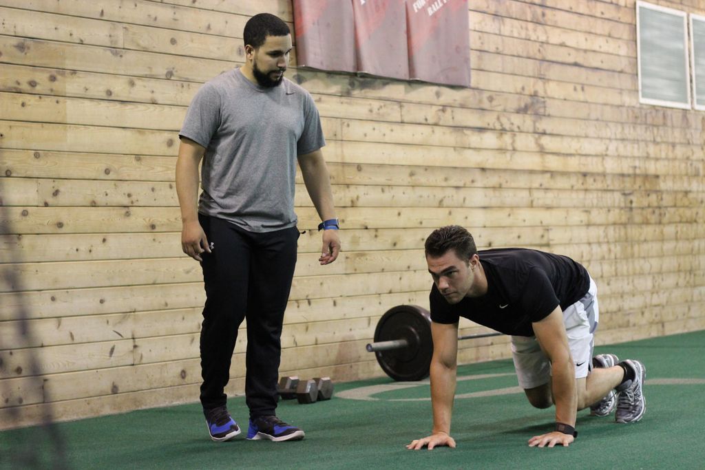 Coaching a bear crawl (core exercise)