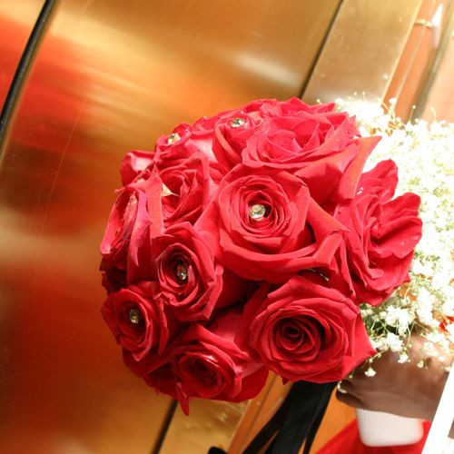 Bride's bouquet (red roses) and bridesmaid's bouqu