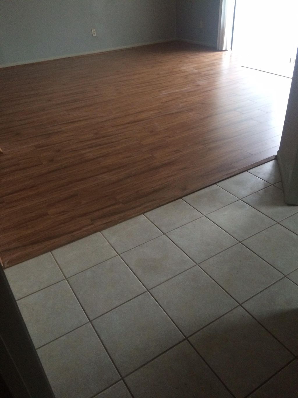 Wood & tile floor. 