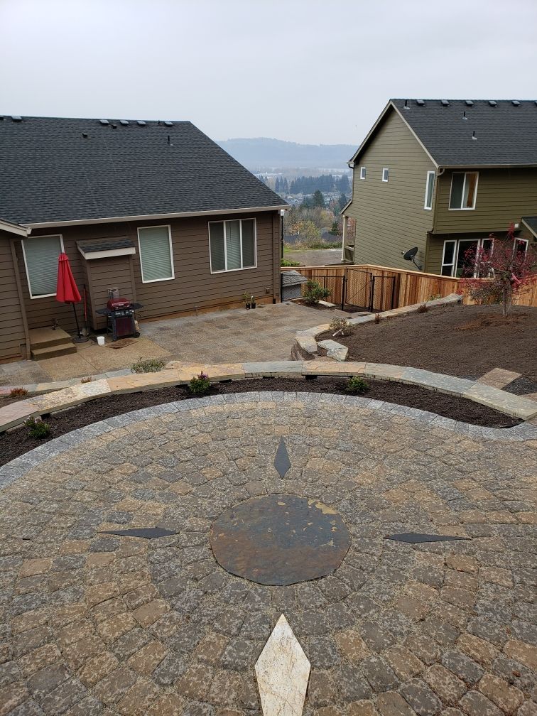 View from upper patio with a compass in the circul