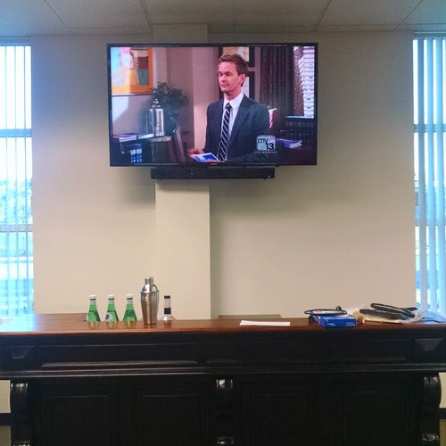 Office TV and bar.
