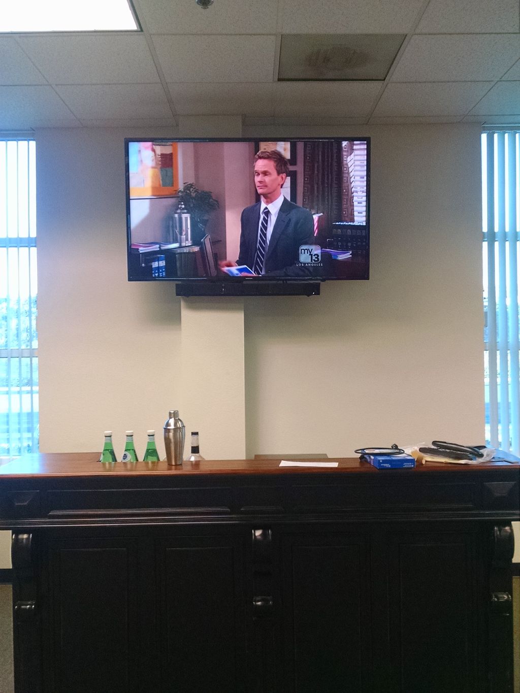 Office TV and bar.