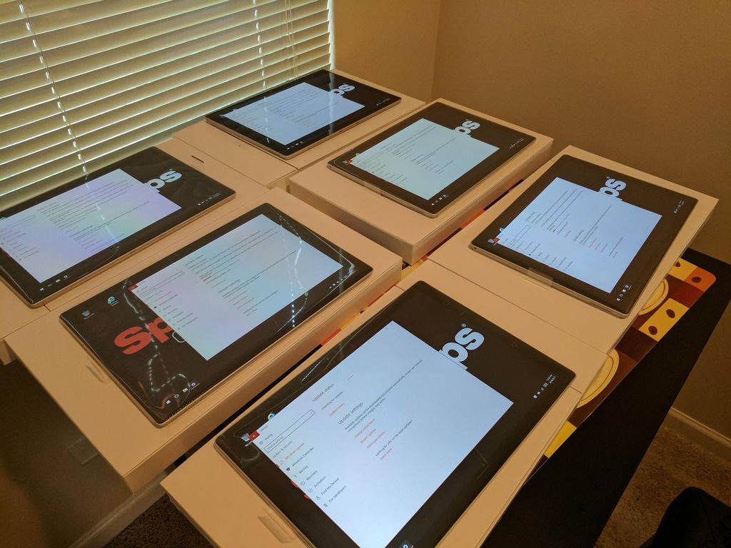 setting up new kiosks for 3 Sport Clips locations.