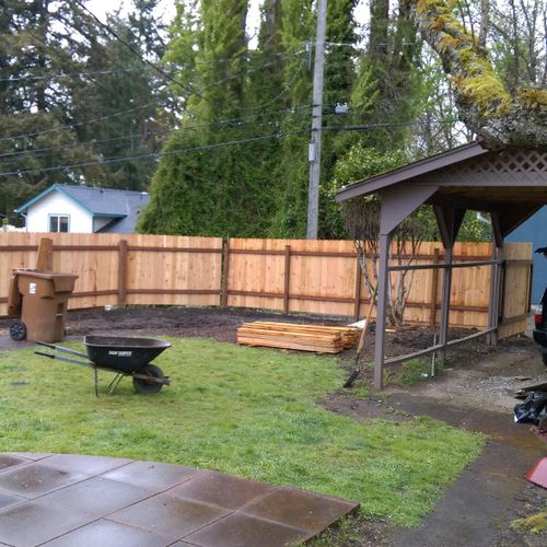 Installation of 6 ft cedar privacy fence.