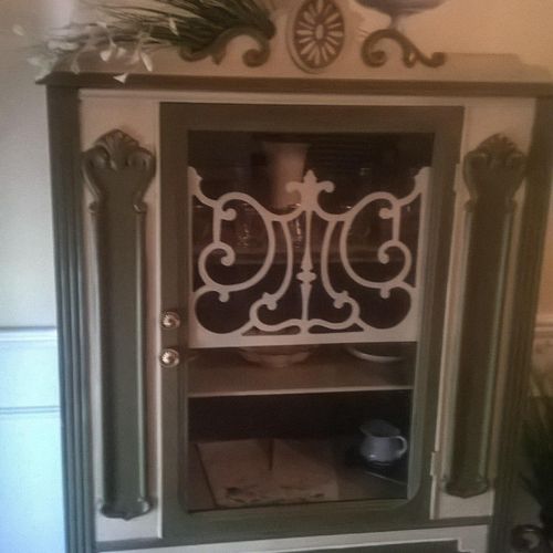 This is an antique china cabinet , under it is a m