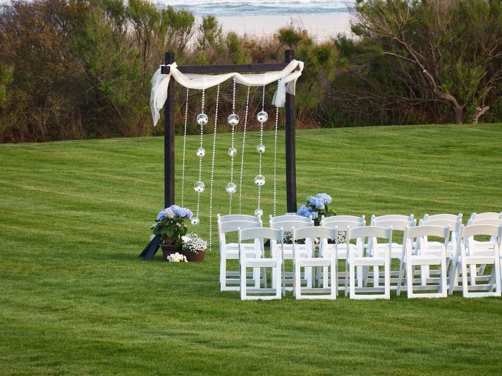 a country club ceremony with a beach and garden ba