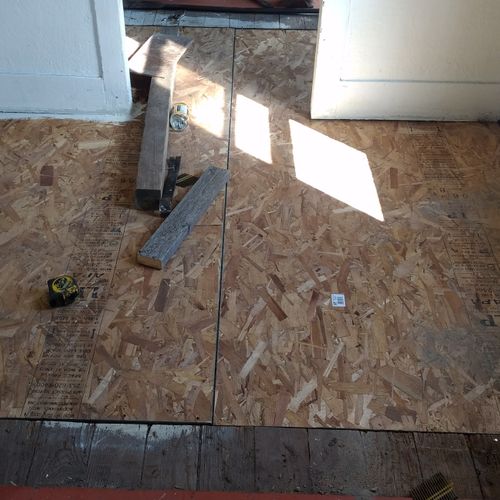 two layers of OSB board lay crisscross, leveling o