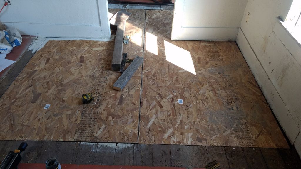 two layers of OSB board lay crisscross, leveling o
