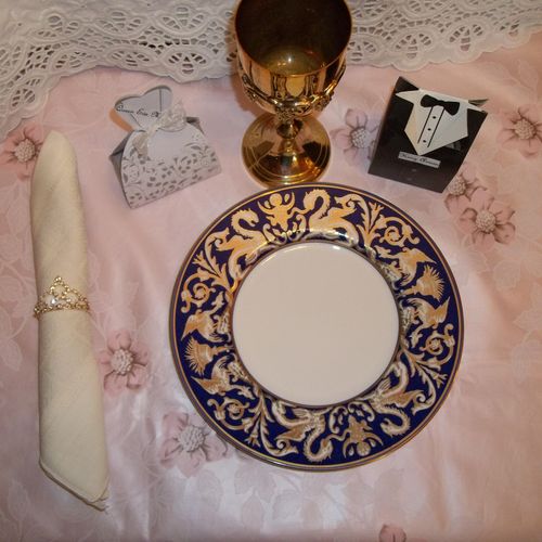 sample place setting with crown napkin holder and 
