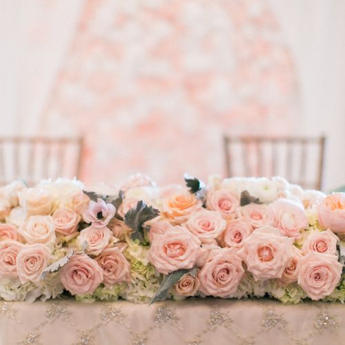 Sweetheart Table + Flower Wall in the Background